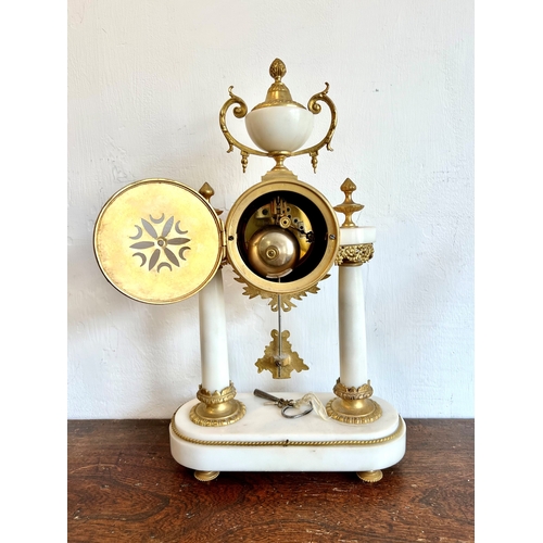 263 - A late 19th century French marble and gilt bronze three-piece clock garniture - the clock with a gre... 