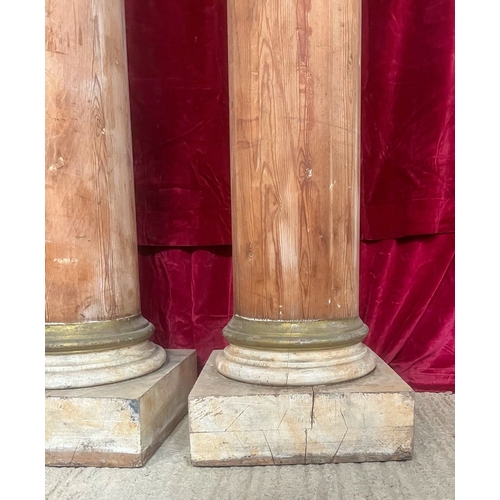 432 - A fine pair of Georgian pine architectural columns - of slightly tapered form, with gilt painted cap... 