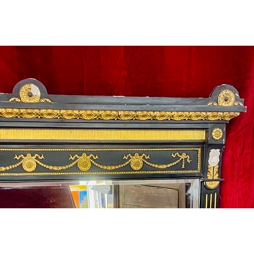 566 - A large Victorian ebonised and parcel gilt overmantel mirror - in the Aesthetic taste, the frame dec... 