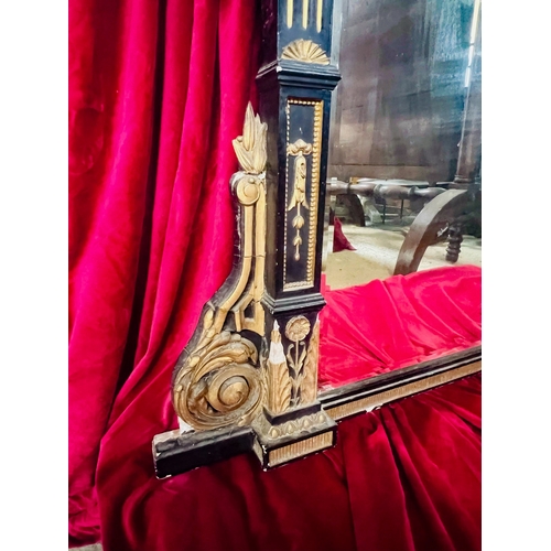 566 - A large Victorian ebonised and parcel gilt overmantel mirror - in the Aesthetic taste, the frame dec... 