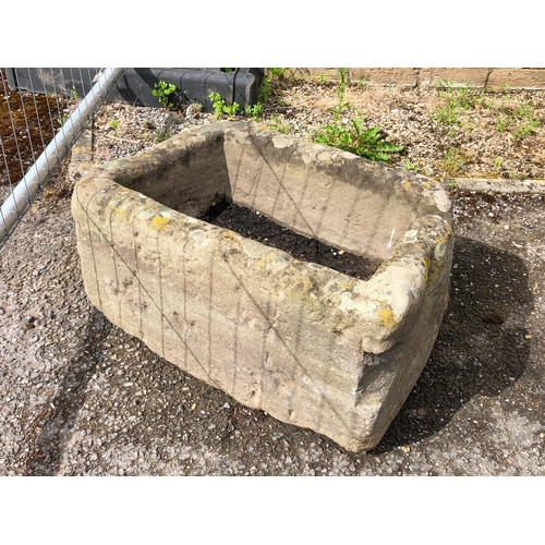 584 - A small antique rectangular carved stone garden trough or planter - LWH 57 x 39 x 29cm.