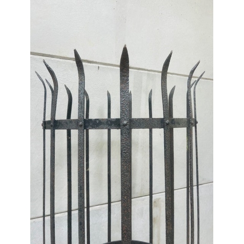 587 - A Victorian / Edwardian wrought iron tree guard - slatted form with flared, spiked top, 188cm high, ... 