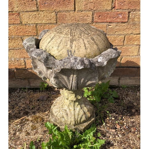 596 - A well weathered composite stone pedestal urn - two piece, with foliate moulded bowl.