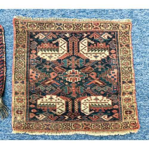 643 - Three hand knotted wool bag faces - the largest Kurdish, 52 x 47cm; one Afshar, 38 x 31cm; and one T... 