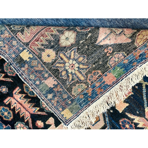 639 - An Armenian single wefted rug - c.1900, the deep blue ground with stylised lozenges and flower heads... 