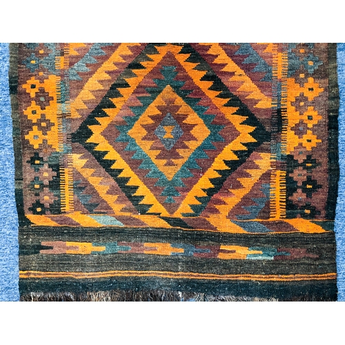 640 - An Afghan Tajik kilim, mid-20th century - with two lozenges worked in orange, green and charcoal, wi... 