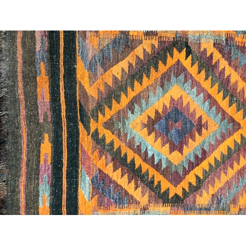 640 - An Afghan Tajik kilim, mid-20th century - with two lozenges worked in orange, green and charcoal, wi... 