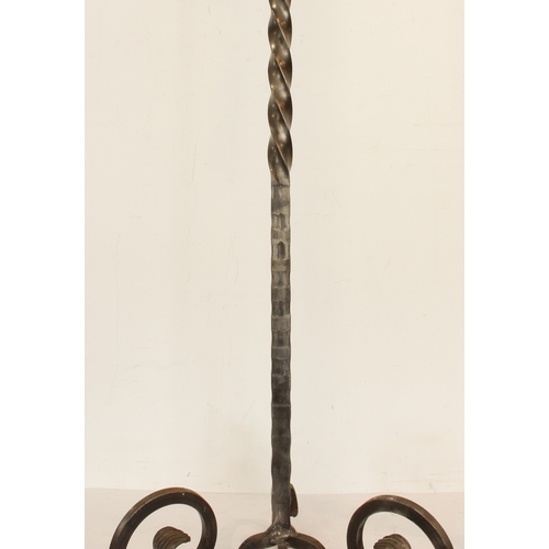 678 - A pair of wrought iron candle stands - modern, painted gunmetal, with part barleytwist and pierced s... 