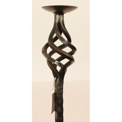 678 - A pair of wrought iron candle stands - modern, painted gunmetal, with part barleytwist and pierced s... 