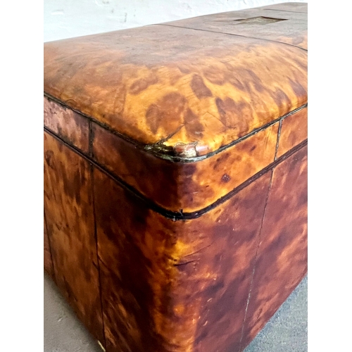 716 - A Regency tortoiseshell tea caddy - rectangular with domed lid and silver metal stringing, on bun fe... 