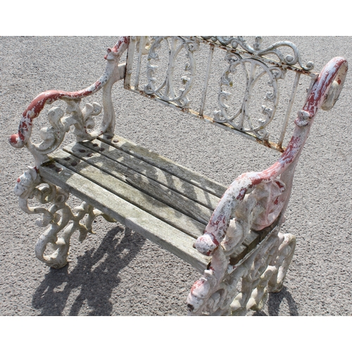 599 - A three piece painted cast metal garden furniture set in the Victorian style - comprising a table wi... 