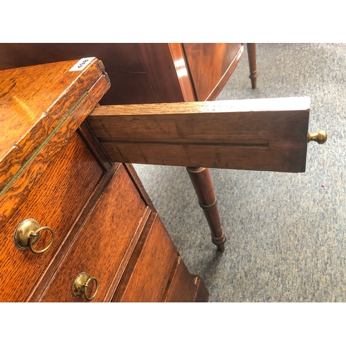 498 - A mid-18th century oak bachelor's chest - the rectangular fold-over top opening on lopers, lined wit... 