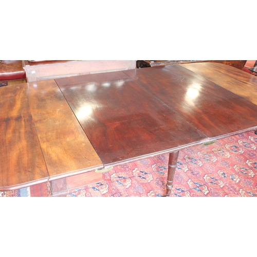 543 - A Regency mahogany dropflap extending dining table with concertina action - the rectangular dropflap... 