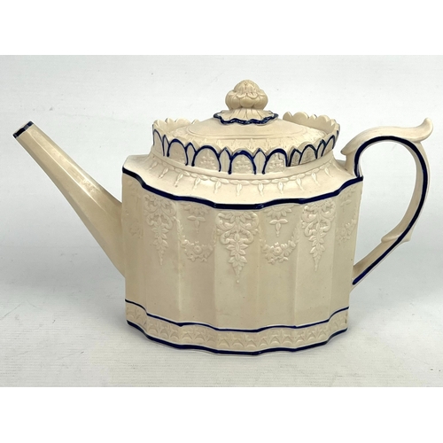 24 - An early 19th century Feldspathic stoneware teapot in the 'Castleford' style, with sliding lid, the ... 