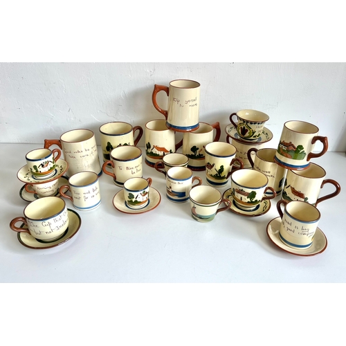 25 - A collection of Torquay pottery mugs, cups and saucers and tankards - all mottoware, including piece... 