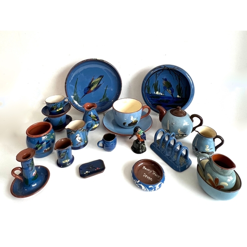 29 - A collection of blue glazed Torquay pottery - including pieces with seagull, parrot, kingfisher, her... 