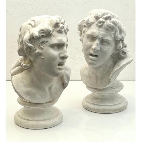 11 - A pair of plaster busts of a young man, after the antique – first half 20th century, 35.5cm high.