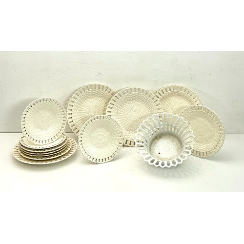 16 - A set of twelve Continental creamware plates, 19th century - circular with pierced lappet rims and b... 