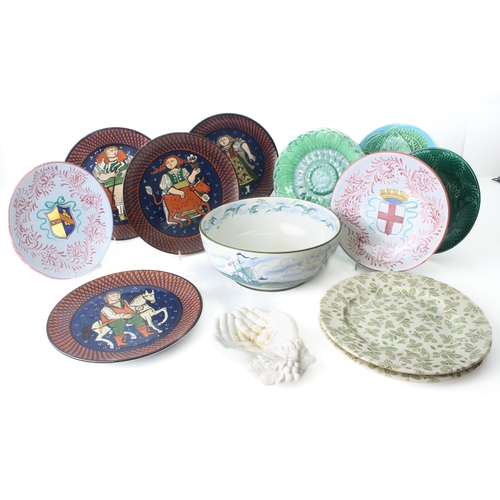 25 - A group of pottery plates and bowls - including two Victorian green majolica glazed 'cabbage' plates... 