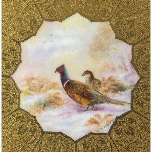 29 - A Royal Worcester gilt and hand painted pheasants cabinet plate - the shaped, circular plate with ri... 