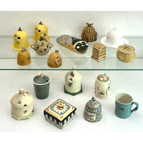 31 - A collection of vintage and modern pottery and bone china honey pots - most of beehive form, includi... 