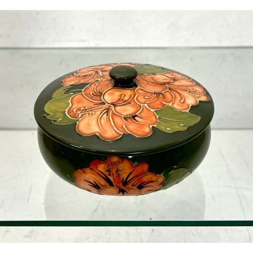 7 - A Moorcroft 'Coral Hibiscus' pattern powder bowl - on a green ground, impressed factory marks, 14.5 ... 