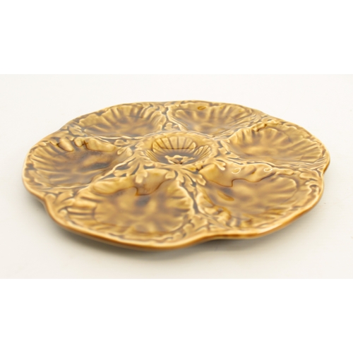 90 - A set of French Gien oyster plates - black printed factory marks, glazed in ochre, 23.75cm diameter.