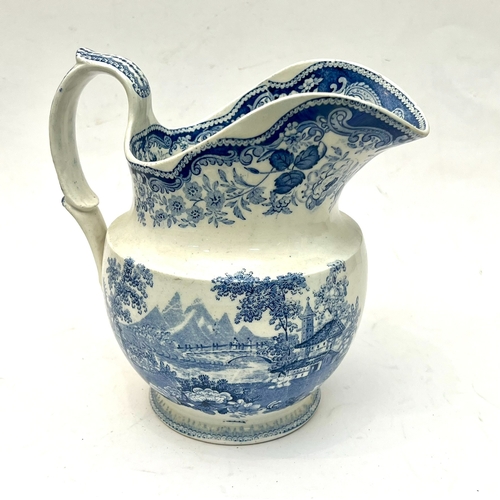 43 - A mid-19th century pearlware blue and white transfer printed jug and bowl - decorated with Orientali... 