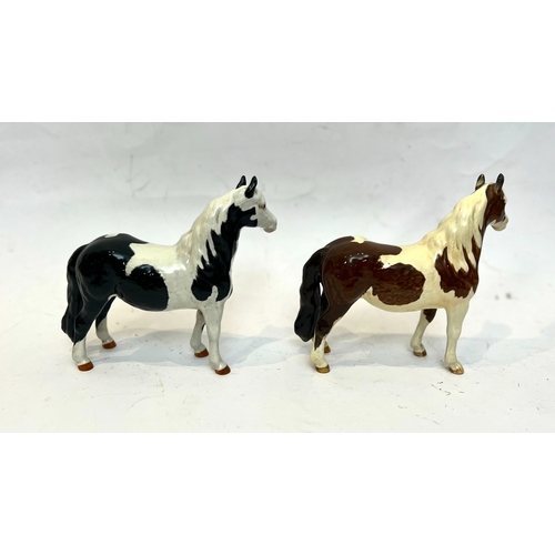 49 - Four Beswick horse figurines - comprising a 1644 dun Highland Pony; a 1549 Tucked Head Horse, chestn... 