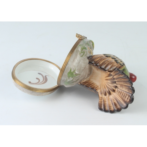 58 - A Limoges porcelain trinket box in the form of a turkey - hand painted, with gilt metal mounts and p... 