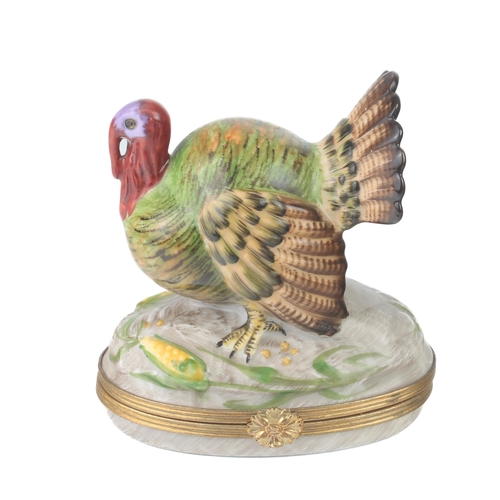 58 - A Limoges porcelain trinket box in the form of a turkey - hand painted, with gilt metal mounts and p... 