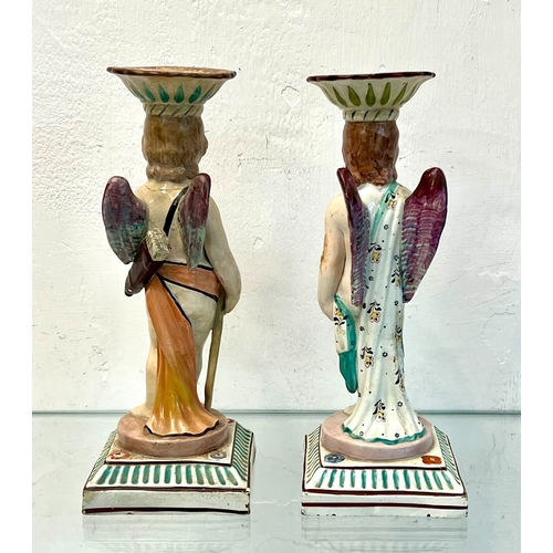 69 - A pair of early 19th century Staffordshire pearlware figural candlesticks by Neale & Co. – modelled ... 