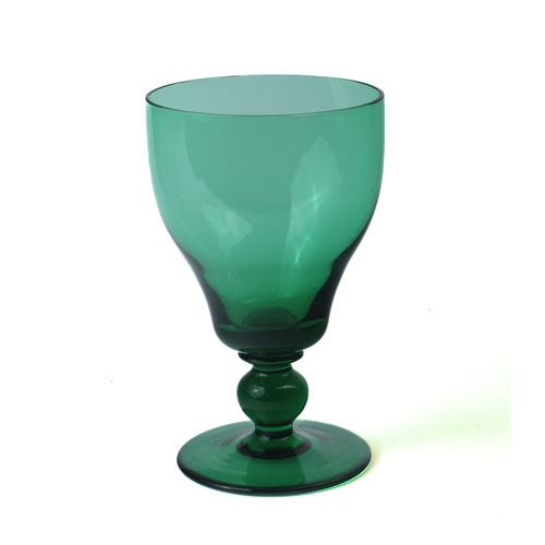 94 - A set of six green glass wine glasses, early 20th century - the ogee bowls on ball knopped stems and... 