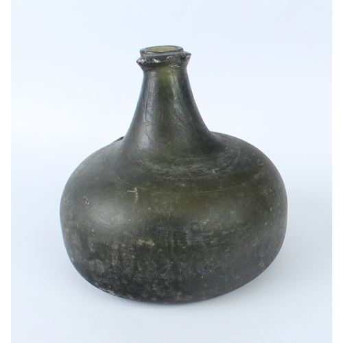 98 - A Queen Anne period sealed half-size armorial 'Onion' wine bottle - the bulbous body with licked-up ... 