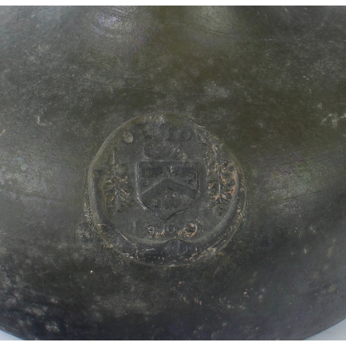 98 - A Queen Anne period sealed half-size armorial 'Onion' wine bottle - the bulbous body with licked-up ... 