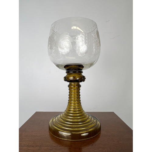 106 - A late-Georgian cut glass wine goblet - the drawn, ovoid bowl with comb cut and flower engraved band... 