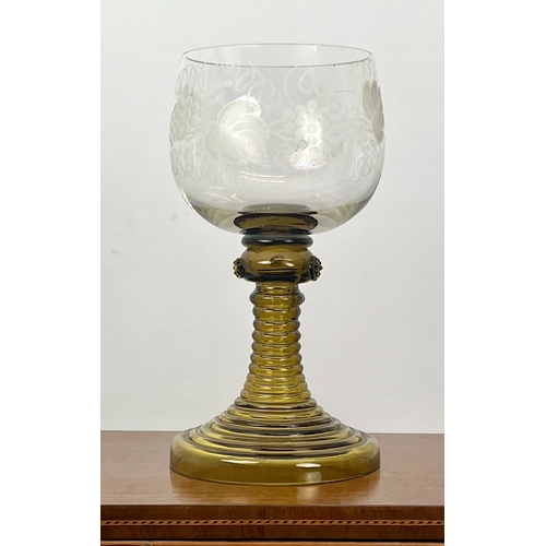 106 - A late-Georgian cut glass wine goblet - the drawn, ovoid bowl with comb cut and flower engraved band... 