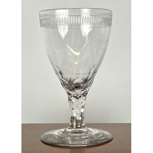 106 - A late-Georgian cut glass wine goblet - the drawn, ovoid bowl with comb cut and flower engraved band... 