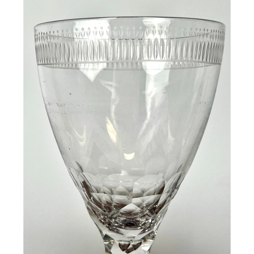 106 - A late-Georgian cut glass wine goblet - the drawn, ovoid bowl with comb cut and flower engraved band... 