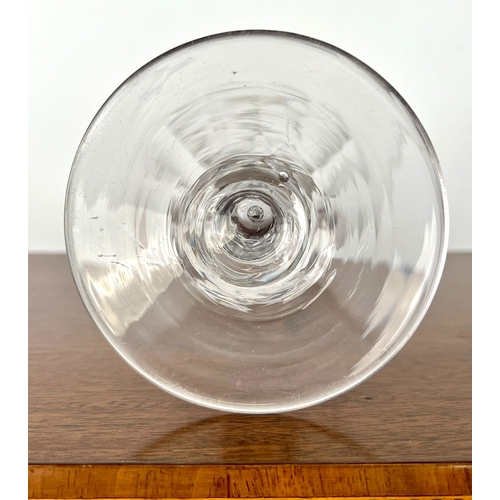 106 - A late-Georgian cut glass wine goblet - the drawn, ovoid bowl with comb cut and flower engraved band... 