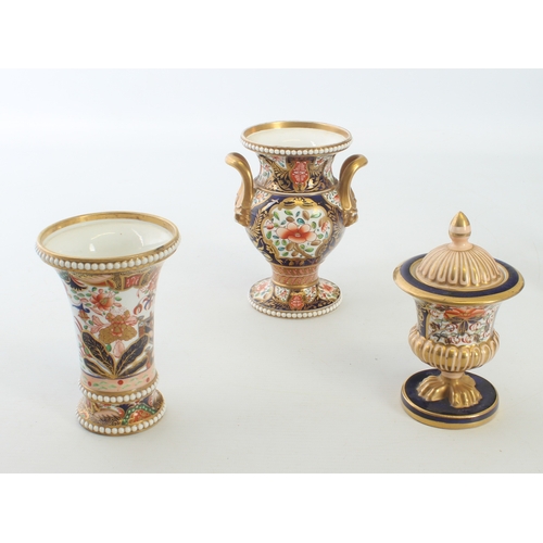 19 - A small collection of mid-19th century Imari decorated English porcelain - including a Spode two han... 