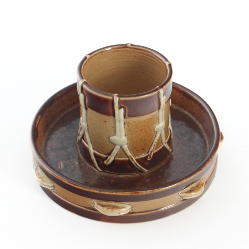 39 - A Doulton Lambeth stoneware match holder and striker c.1900 in the form of a drum and tambourine