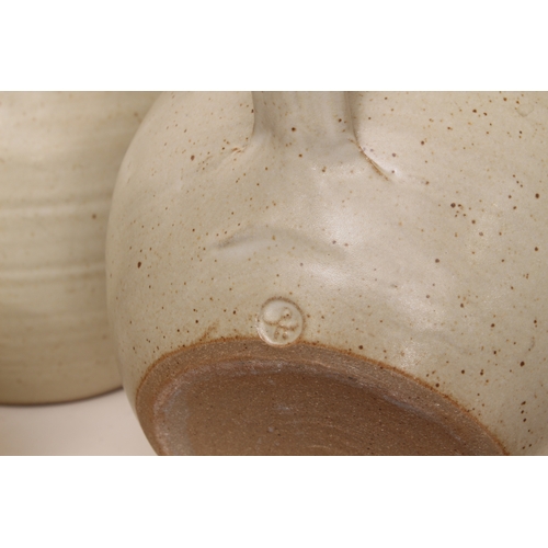 1036 - Winchcombe Pottery: five pieces of stoneware studio pottery - in a mottled cream glaze, comprising a... 