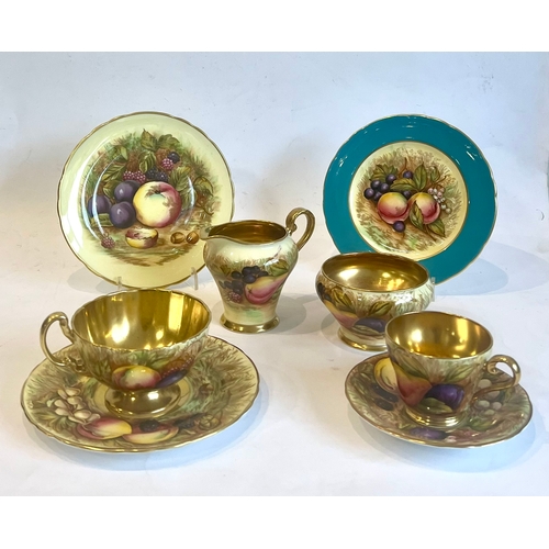 77 - An Aynsley 'Orchard Gold' fruit painted part tea and coffee service - green printed factory marks, w... 