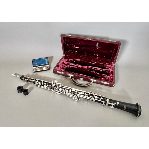 A cased Hans Kreul (of Tubingen) African blackwood oboe - serial