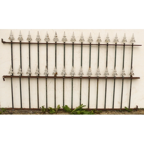 Two sections of short railings with arrow spikes, both sections ...