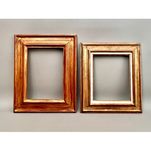 Four modern rectangular gilt picture frames - comprising a plain water ...