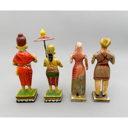 A group of ten carved wooden and hand painted Indian figures - mostly ...
