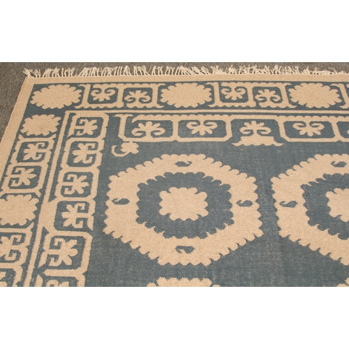 An OKA Chelak flatweave wool rug - in indigo blue and natural colourway ...