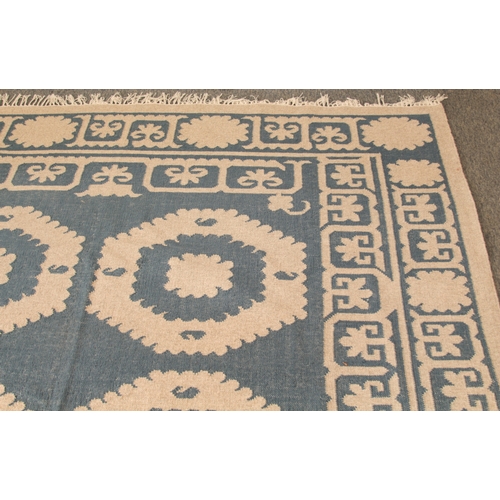 An OKA Chelak flatweave wool rug - in indigo blue and natural colourway ...